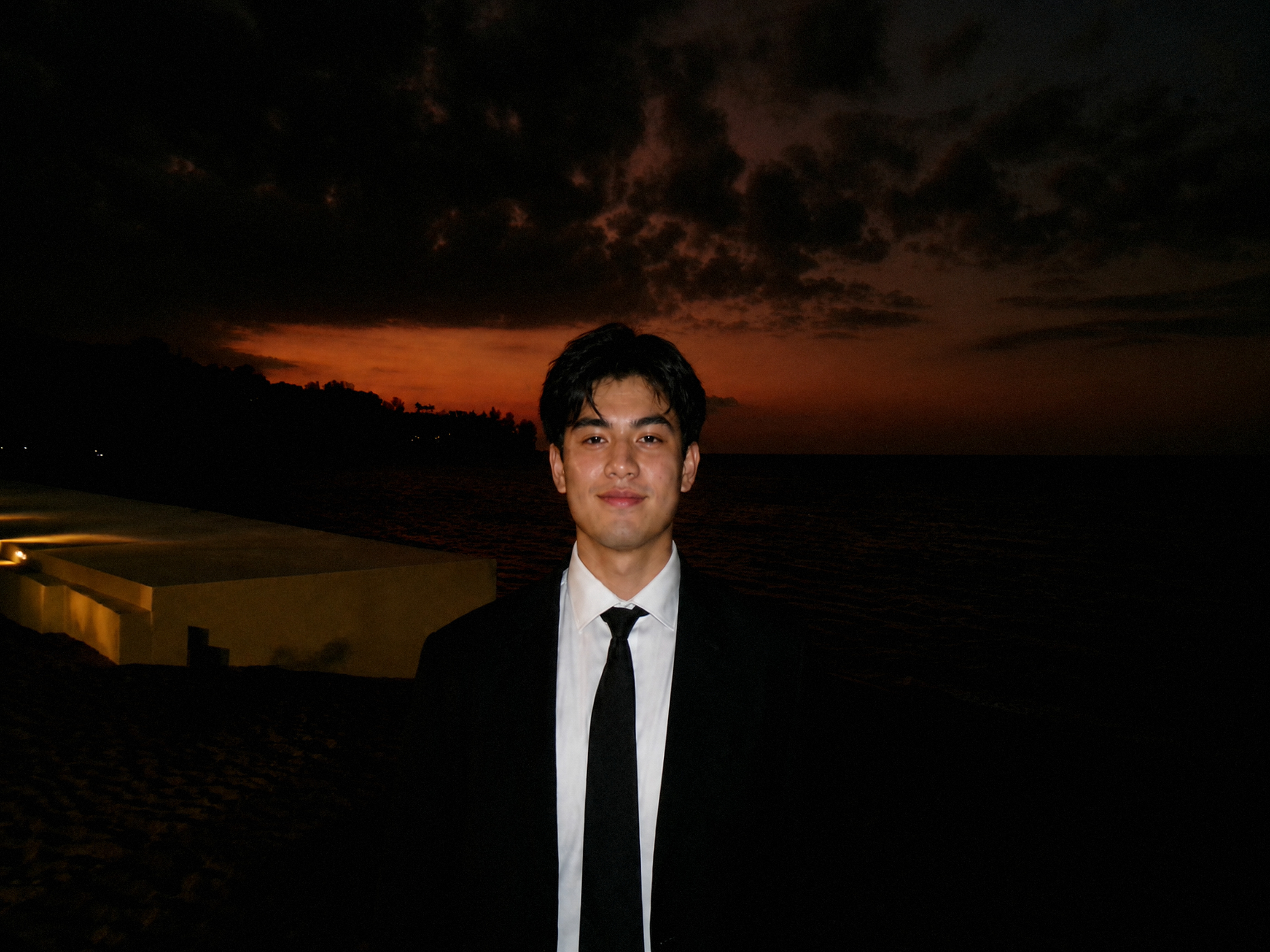 Guest in a suit at sunset — from the day